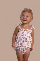 FLOWERS AND BOOTS DREAM BUBBLE ROMPER from DREAM BIG LITTLE CO