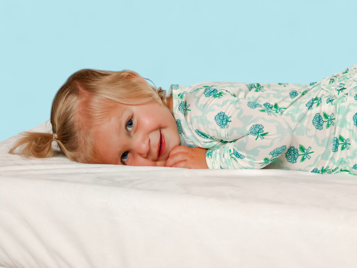 BLUE RIBBON BLOOMS DREAM RUFFLE ROMPER from DREAM BIG LITTLE CO