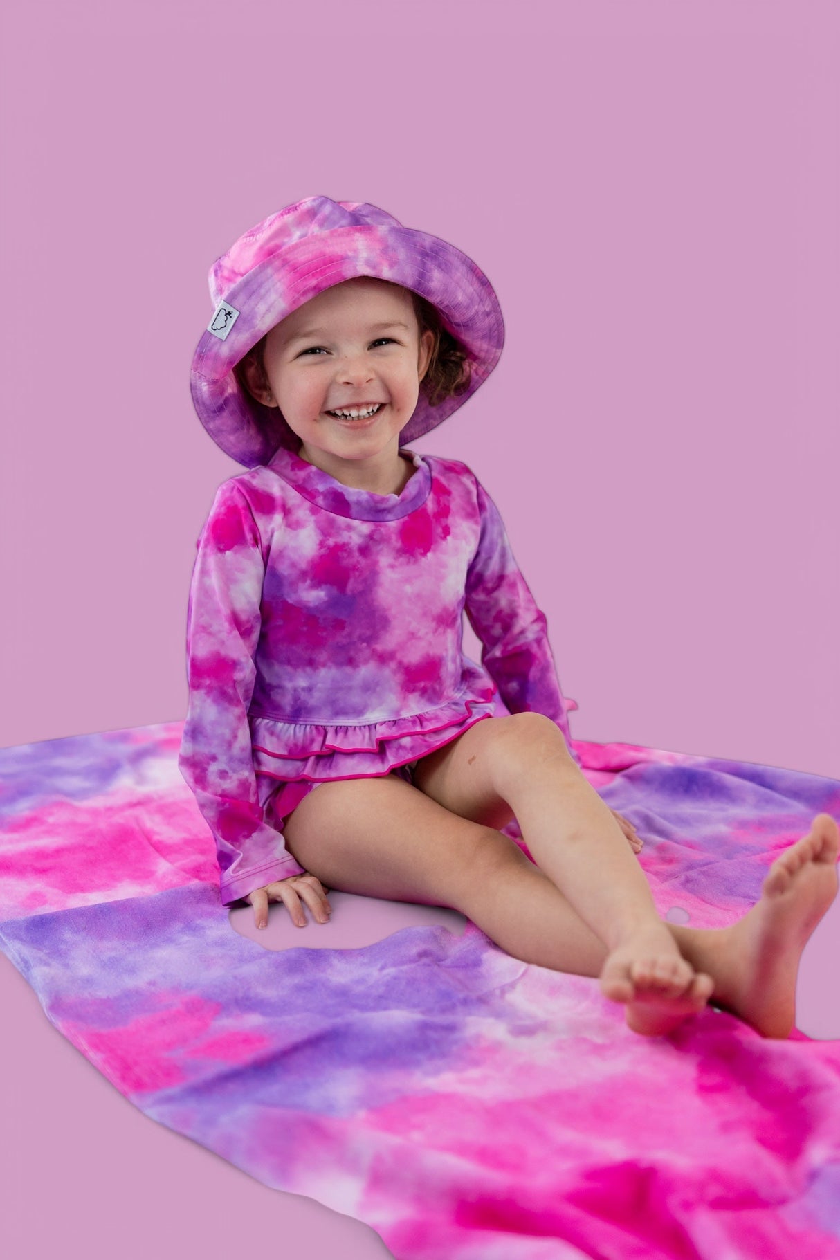 CANDY CLOUDS DREAM 2-PIECE RASH GUARD RUFFLE SWIM SUIT from DREAM BIG LITTLE CO