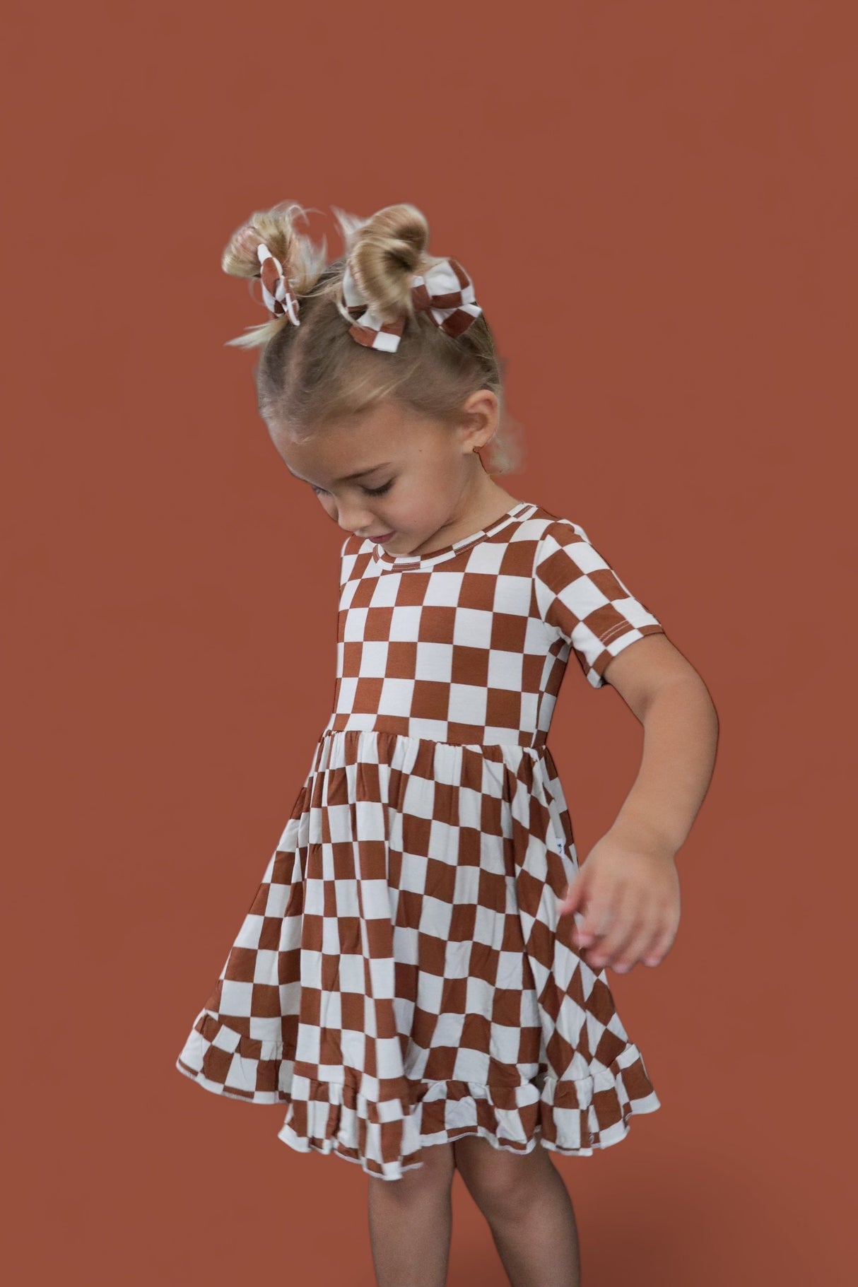 COPPER CHECKERS DREAM RUFFLE DRESS from DREAM BIG LITTLE CO
