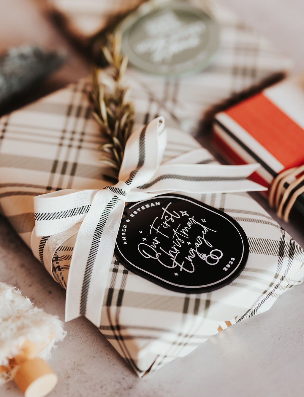 Our First Christmas Engaged with Year Acrylic Modern Ornament from The Cotton & Canvas Co.
