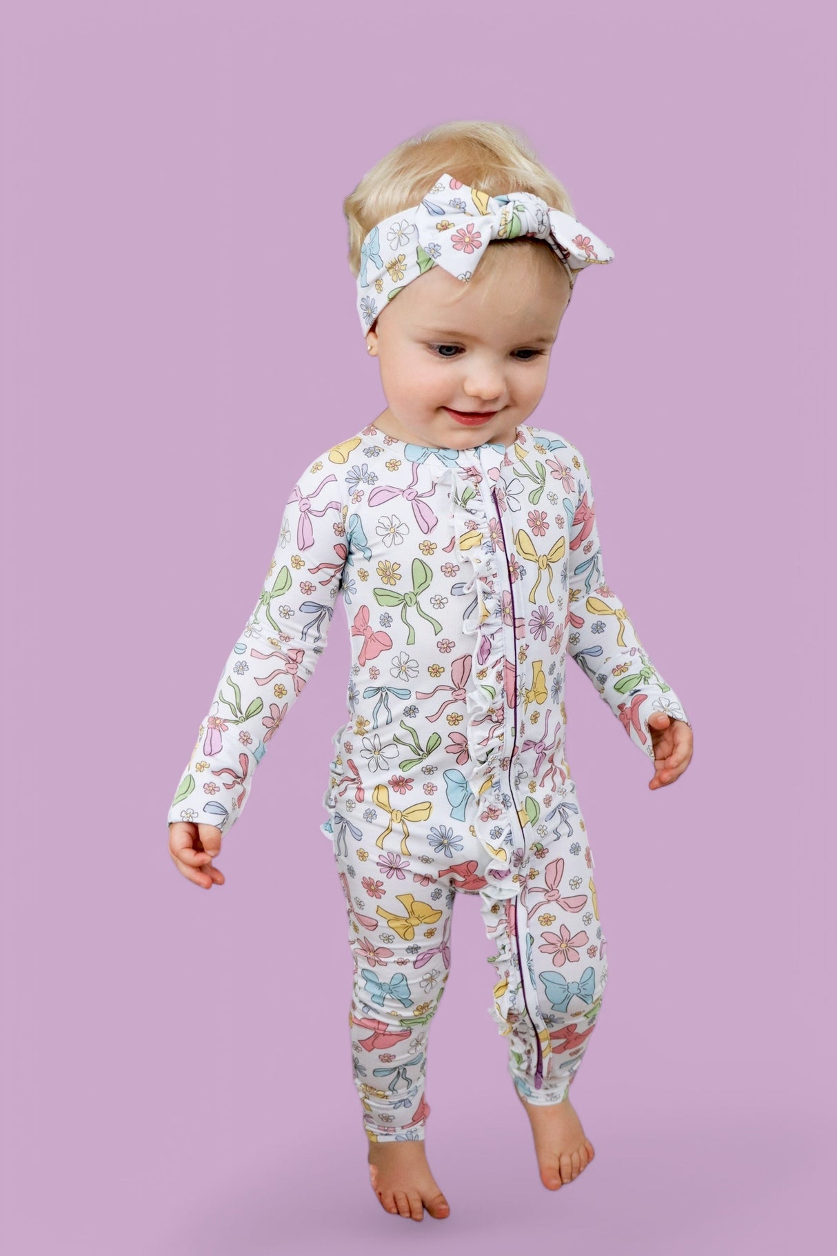 BOW GARDEN DREAM RUFFLE ROMPER from DREAM BIG LITTLE CO