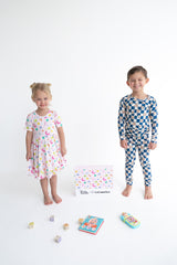 Dream Big Little Co x CoComelon ALPHABET SHORT SLEEVE DREAM RUFFLE DRESS from DREAM BIG LITTLE CO