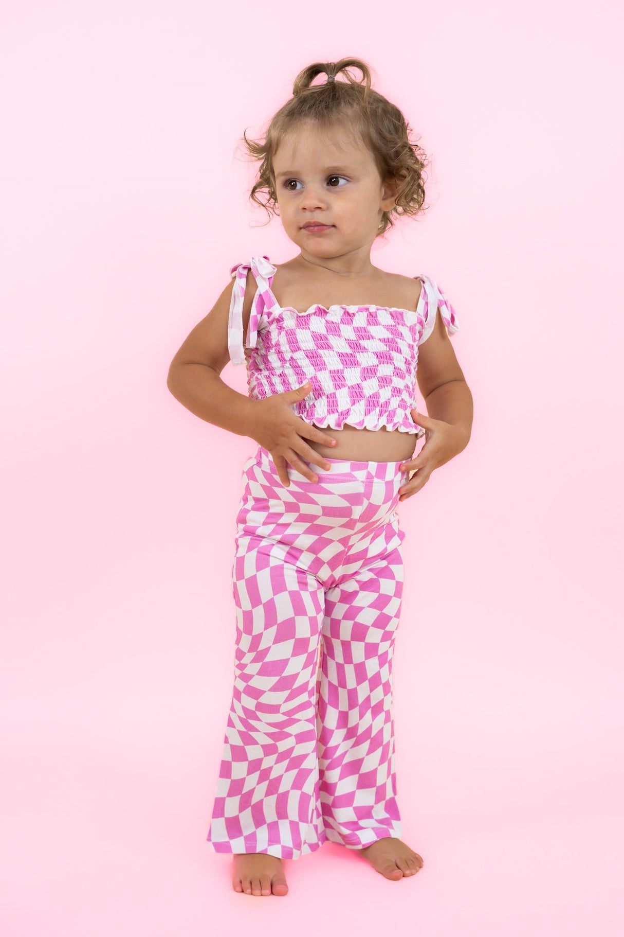 BUBBLEGUM WAVY CHECKERS DREAM SMOCKED FLARE SET from DREAM BIG LITTLE CO