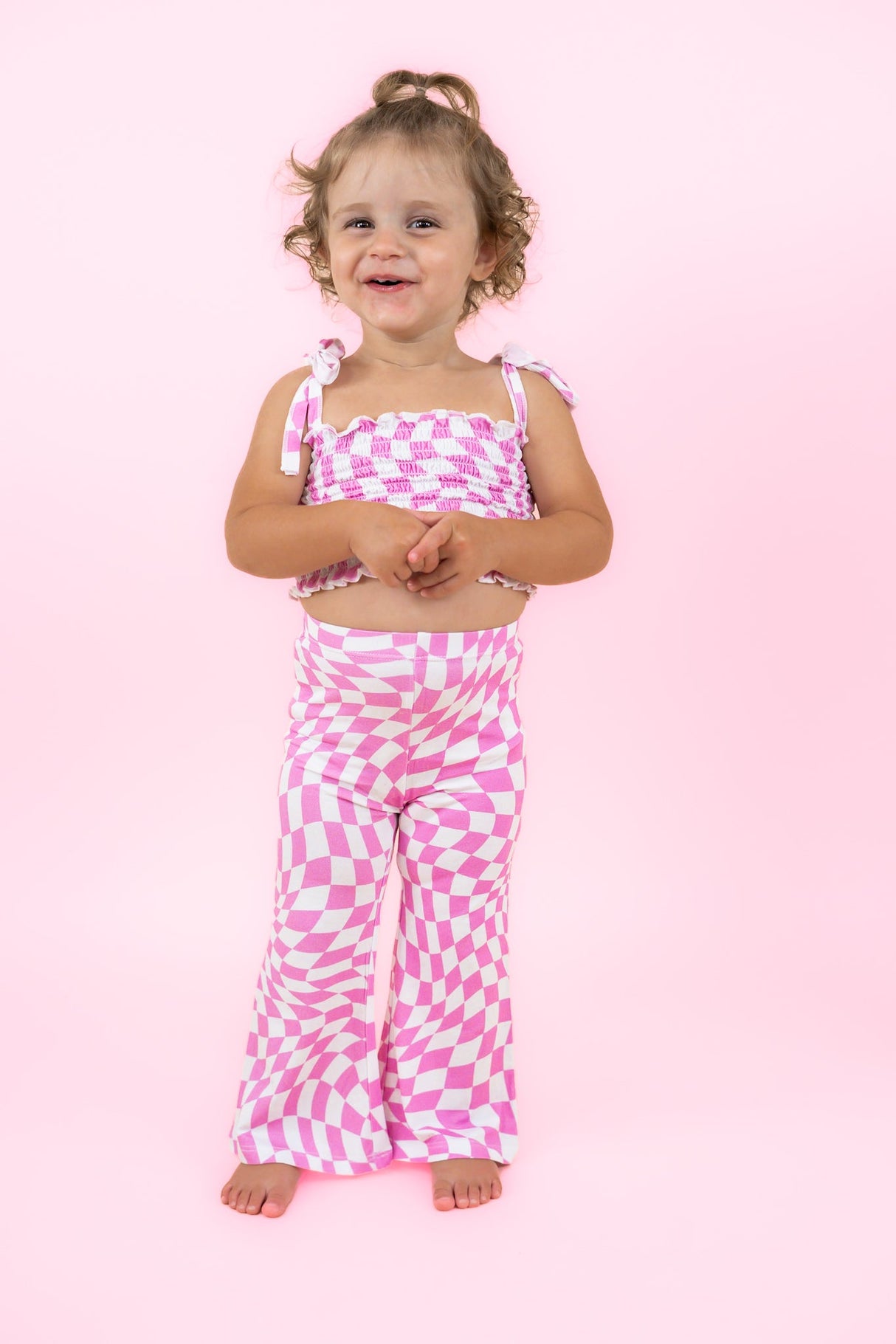 BUBBLEGUM WAVY CHECKERS DREAM SMOCKED FLARE SET from DREAM BIG LITTLE CO
