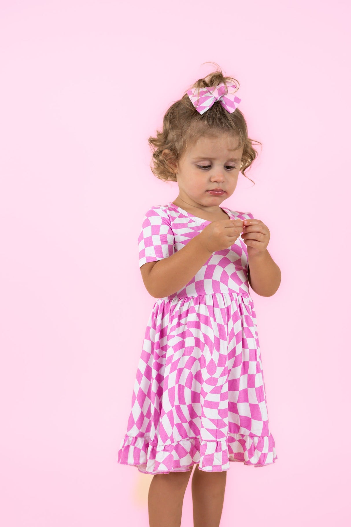 BUBBLEGUM WAVY CHECKERS DREAM RUFFLE DRESS from DREAM BIG LITTLE CO