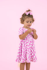 BUBBLEGUM WAVY CHECKERS DREAM RUFFLE DRESS from DREAM BIG LITTLE CO