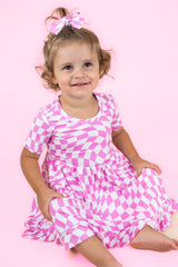 BUBBLEGUM WAVY CHECKERS DREAM RUFFLE DRESS from DREAM BIG LITTLE CO