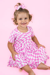 BUBBLEGUM WAVY CHECKERS DREAM RUFFLE DRESS from DREAM BIG LITTLE CO