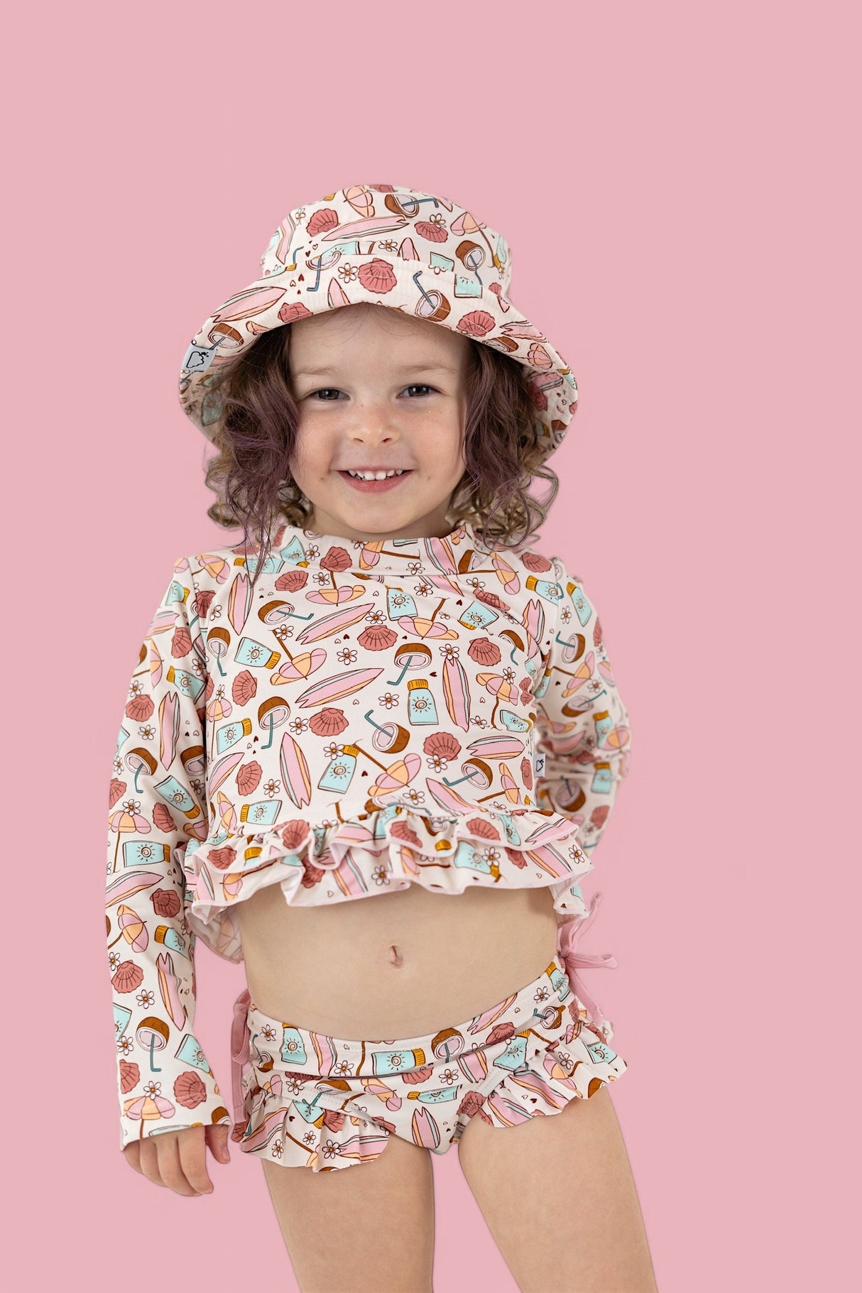 FUN IN THE SUN DREAM TWO-PIECE RASH GUARD RUFFLE SWIM SUIT from DREAM BIG LITTLE CO
