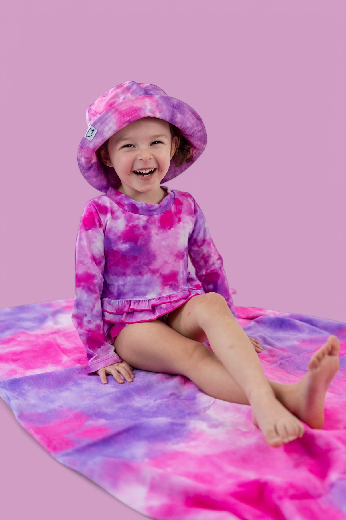 CANDY CLOUDS DREAM 2-PIECE RASH GUARD RUFFLE SWIM SUIT from DREAM BIG LITTLE CO
