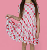 DREAMY PINK CHECKERS DREAM RUFFLE DRESS from DREAM BIG LITTLE CO