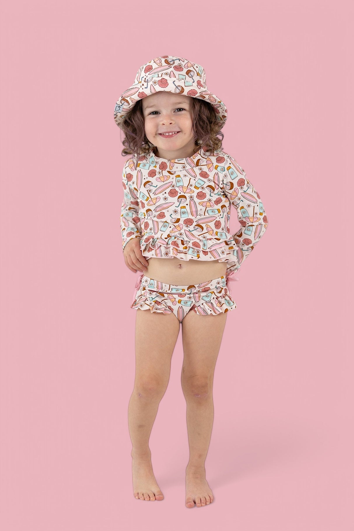 FUN IN THE SUN DREAM TWO-PIECE RASH GUARD RUFFLE SWIM SUIT from DREAM BIG LITTLE CO