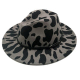 Faux Leather Band Cattle Patterned Panama Hat from Madeline Love