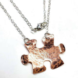 Handmade Hammered Copper Puzzle Piece Necklace from Alexa Martha Designs