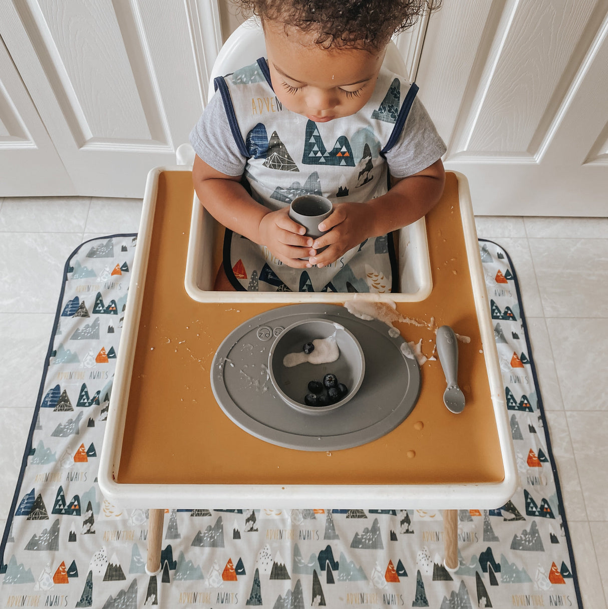 Adventure Awaits Splash Mat - A Waterproof Catch-All for Highchair Spills and More! from BapronBaby
