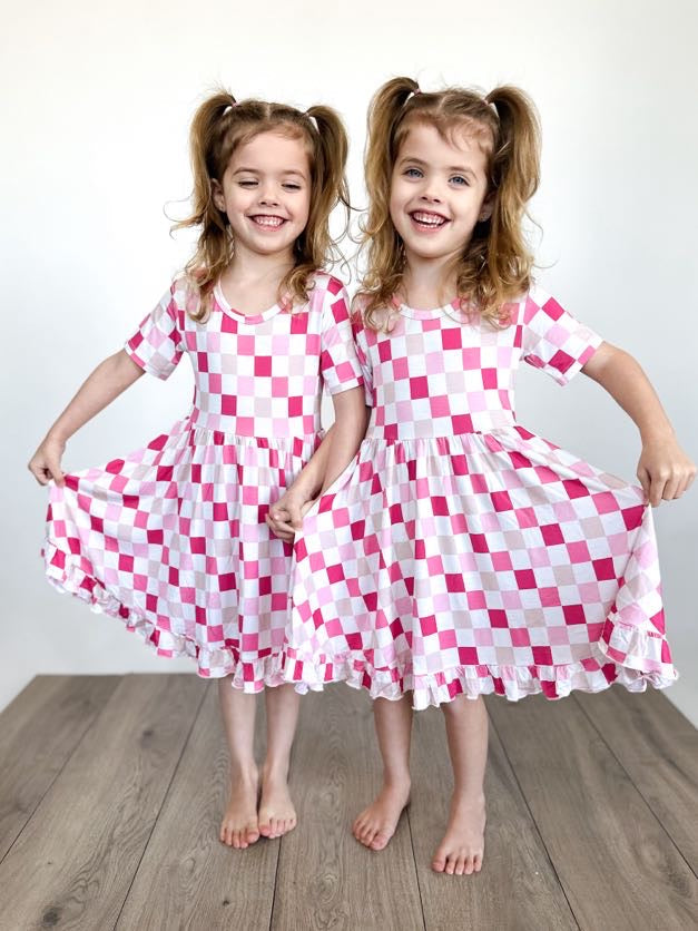 DREAMY PINK CHECKERS DREAM RUFFLE DRESS from DREAM BIG LITTLE CO
