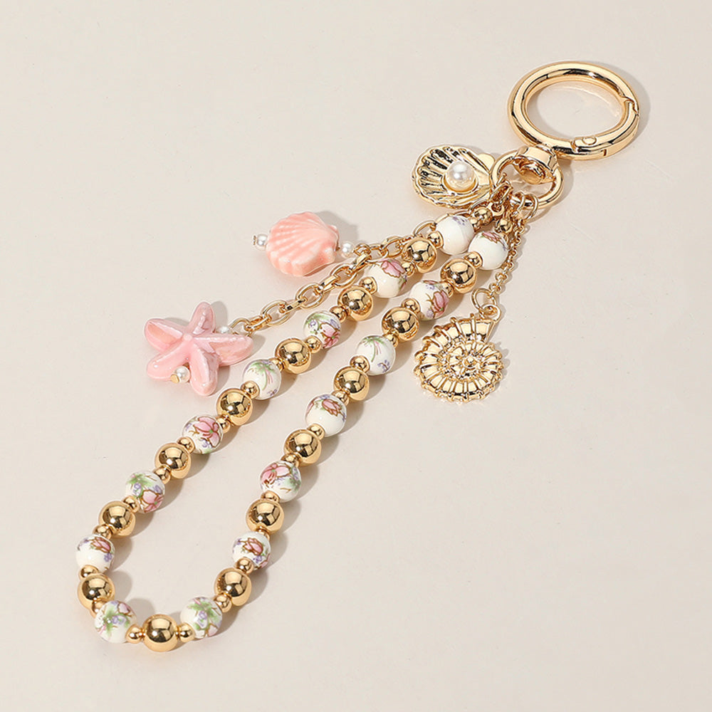 Ceramic Starfish Seashell Metal Pearl Sea Shell Charm Embellished Floral Ceramic Metal Ball Beaded Wristlet Keychain / Bag Charm from Madeline Love