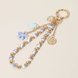 Ceramic Starfish Seashell Metal Pearl Sea Shell Charm Embellished Floral Ceramic Metal Ball Beaded Wristlet Keychain / Bag Charm from Madeline Love