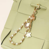 Ceramic Starfish Seashell Metal Pearl Sea Shell Charm Embellished Floral Ceramic Metal Ball Beaded Wristlet Keychain / Bag Charm from Madeline Love