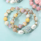 2PCS - Ceramic Snail Conch Shell Pearl Natural Stone Beaded Stretch Multi Layered Bracelets from Madeline Love