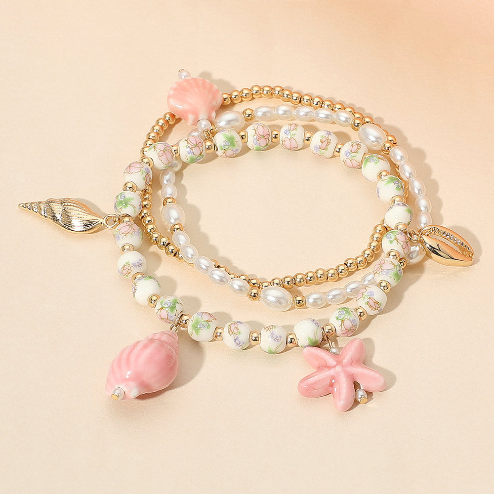 3PCS - Ceramic Starfish Sea Shell Charm Pearl Beaded Stretch Multi Layered Bracelets from Madeline Love