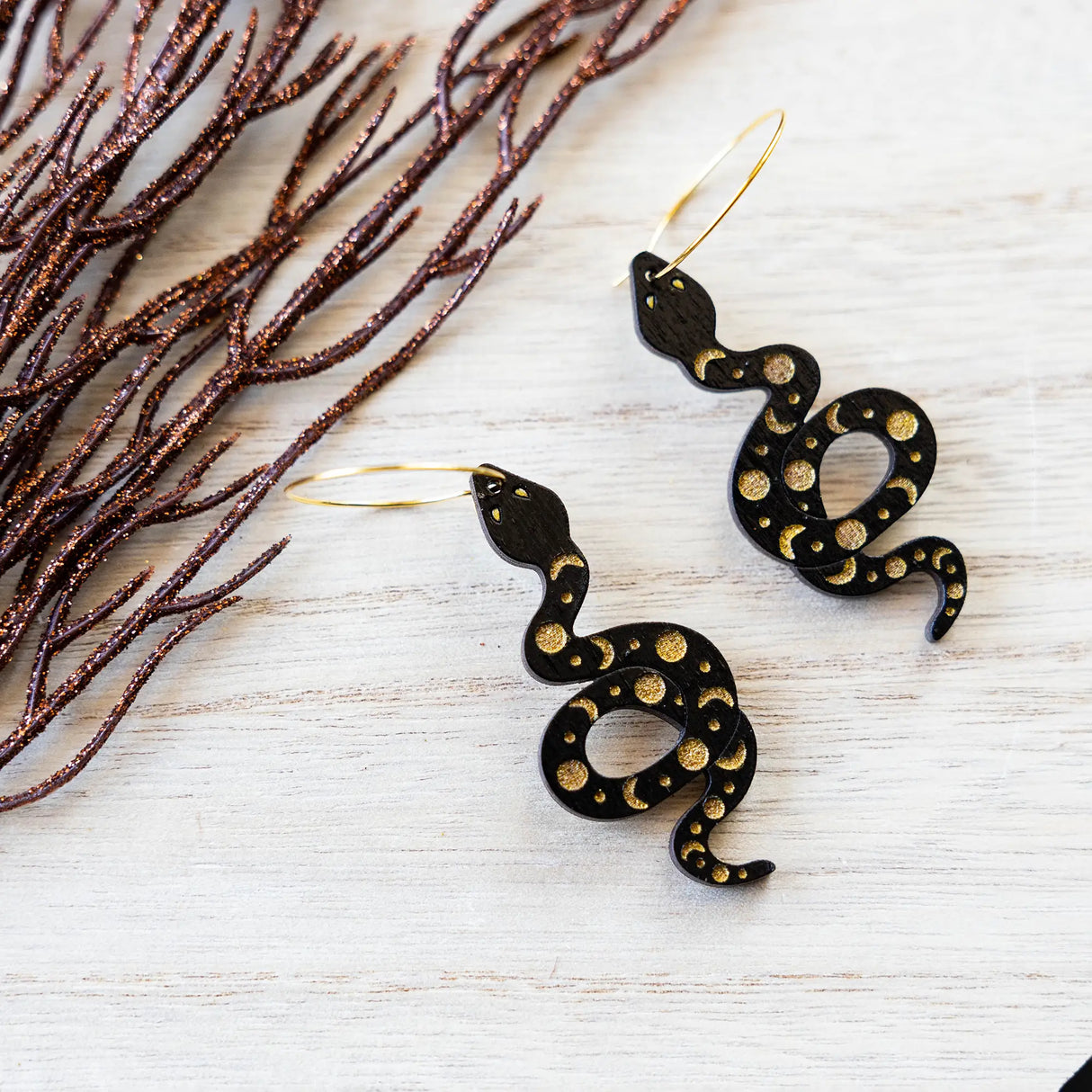 Moon Phases Snake Hoops from LE CHIC MIAMI