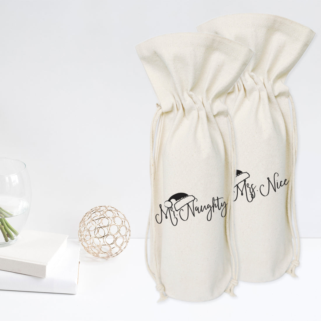Mr. Naughty and Mrs. Nice Christmas Cotton Canvas Wine Bag, 2-pack from The Cotton & Canvas Co.