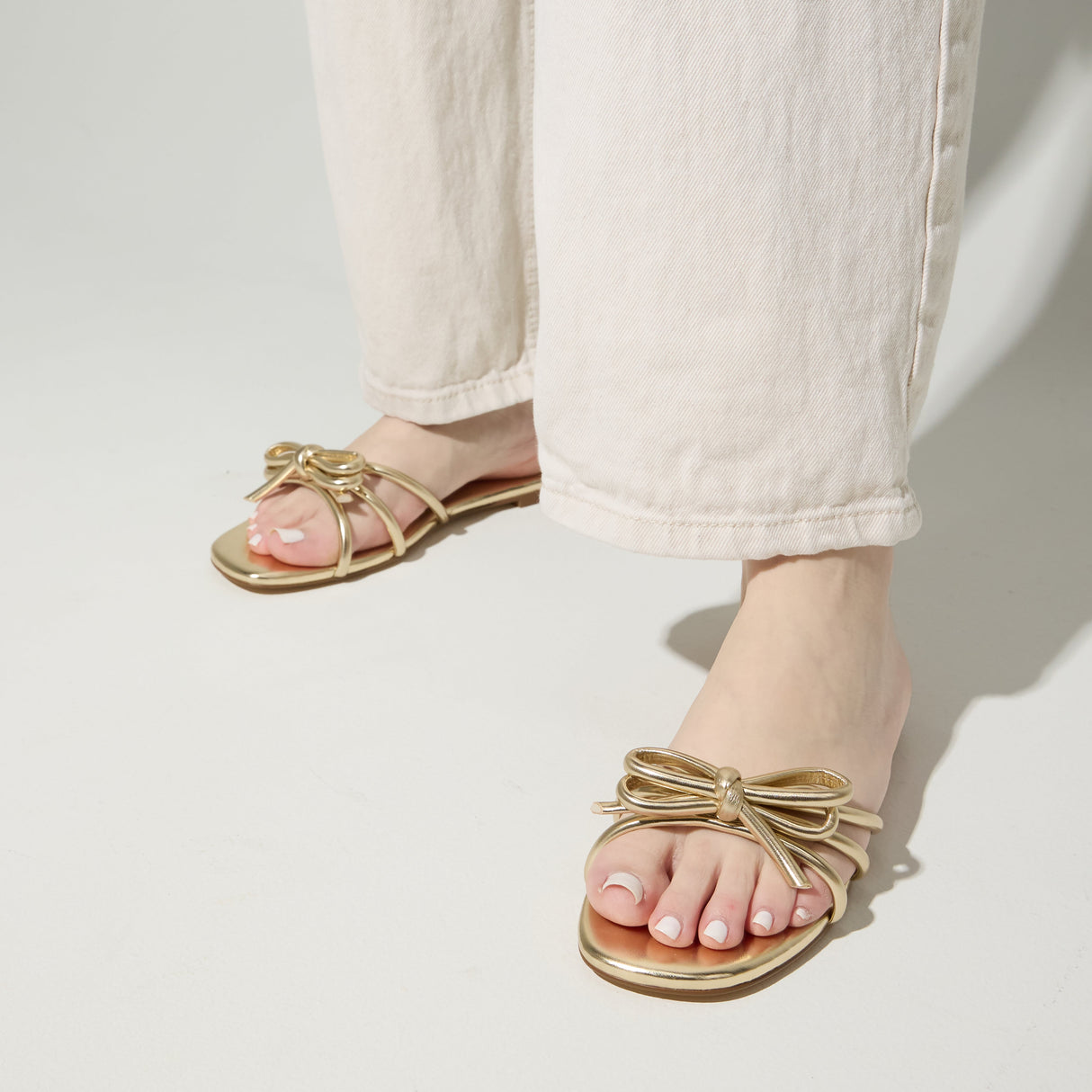 Nicole Bow Slide Sandal in Gold from Yosi Samra