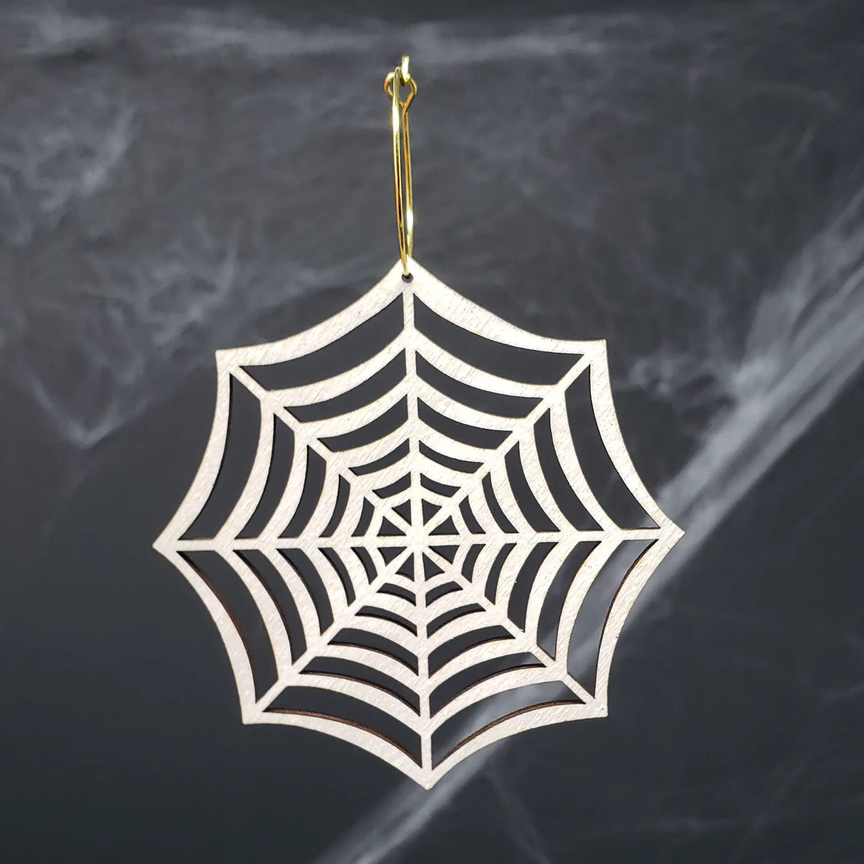 Iridescent Spider Web Hoops from LE CHIC MIAMI