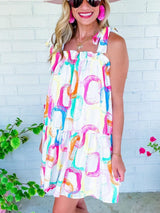 Abstract White Ruffled Mini Dress with Knotted Straps from MsDressly