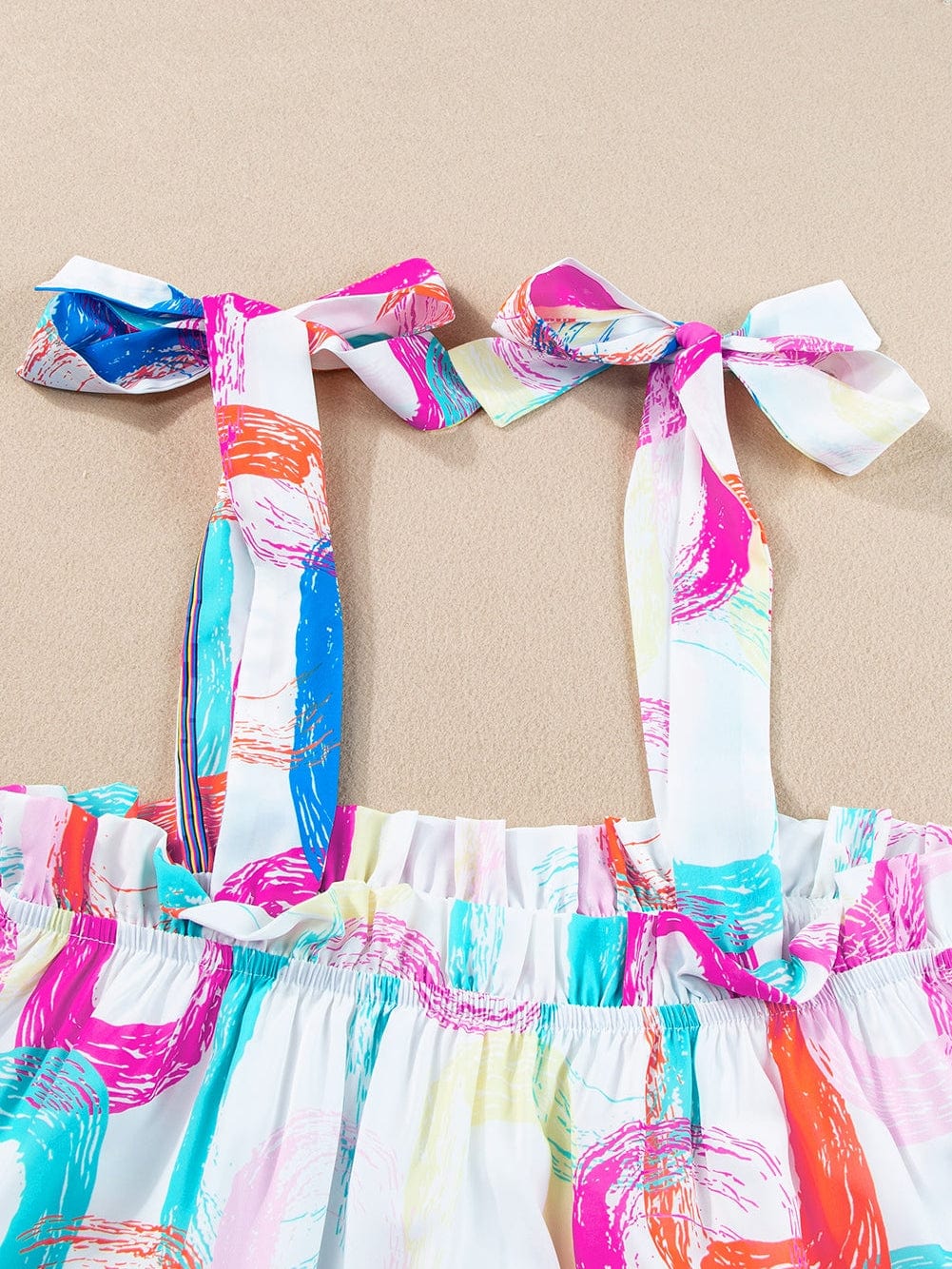 Abstract White Ruffled Mini Dress with Knotted Straps from MsDressly
