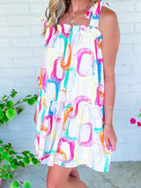 Abstract White Ruffled Mini Dress with Knotted Straps from MsDressly
