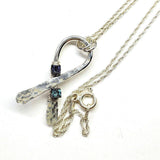 Silver Suicide Prevention Awareness Ribbon Necklace with Purple and Teal Crystals from Alexa Martha Designs