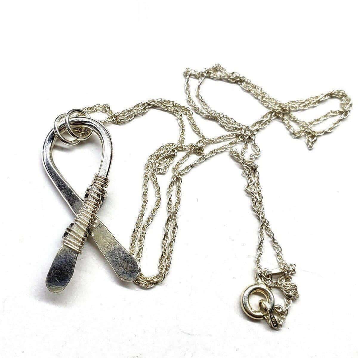 Silver Suicide Prevention Awareness Ribbon Necklace with Purple and Teal Crystals from Alexa Martha Designs