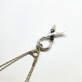 Silver Suicide Prevention Awareness Ribbon Necklace with Purple and Teal Crystals from Alexa Martha Designs
