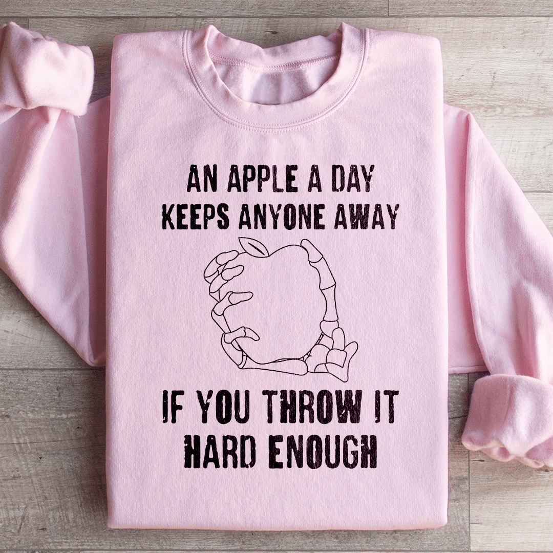 An Apple A Day Keeps Anyone Away If You Throw It Hard Enough Sweatshirt from Peachy Sunday
