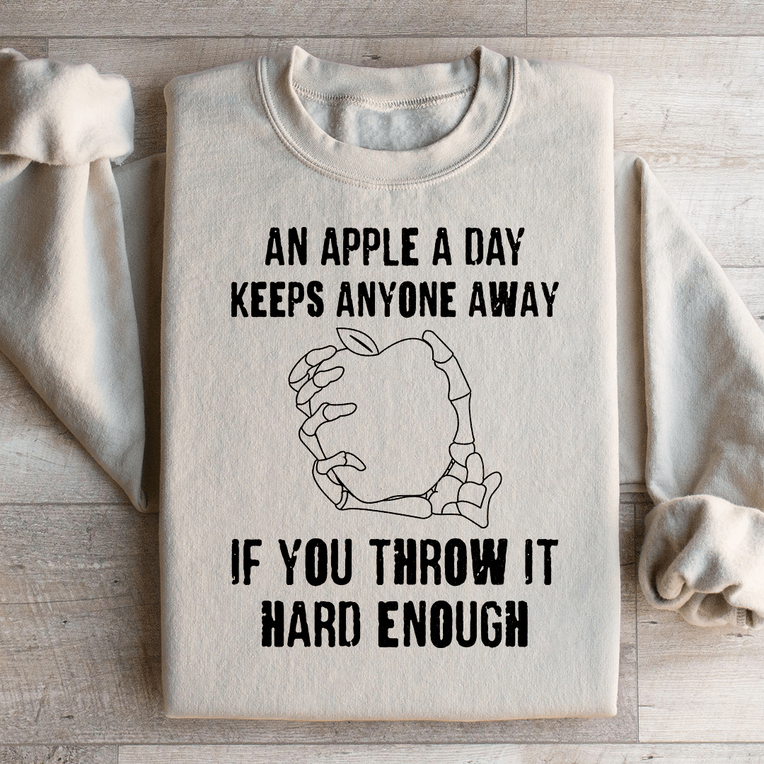 An Apple A Day Keeps Anyone Away If You Throw It Hard Enough Sweatshirt from Peachy Sunday
