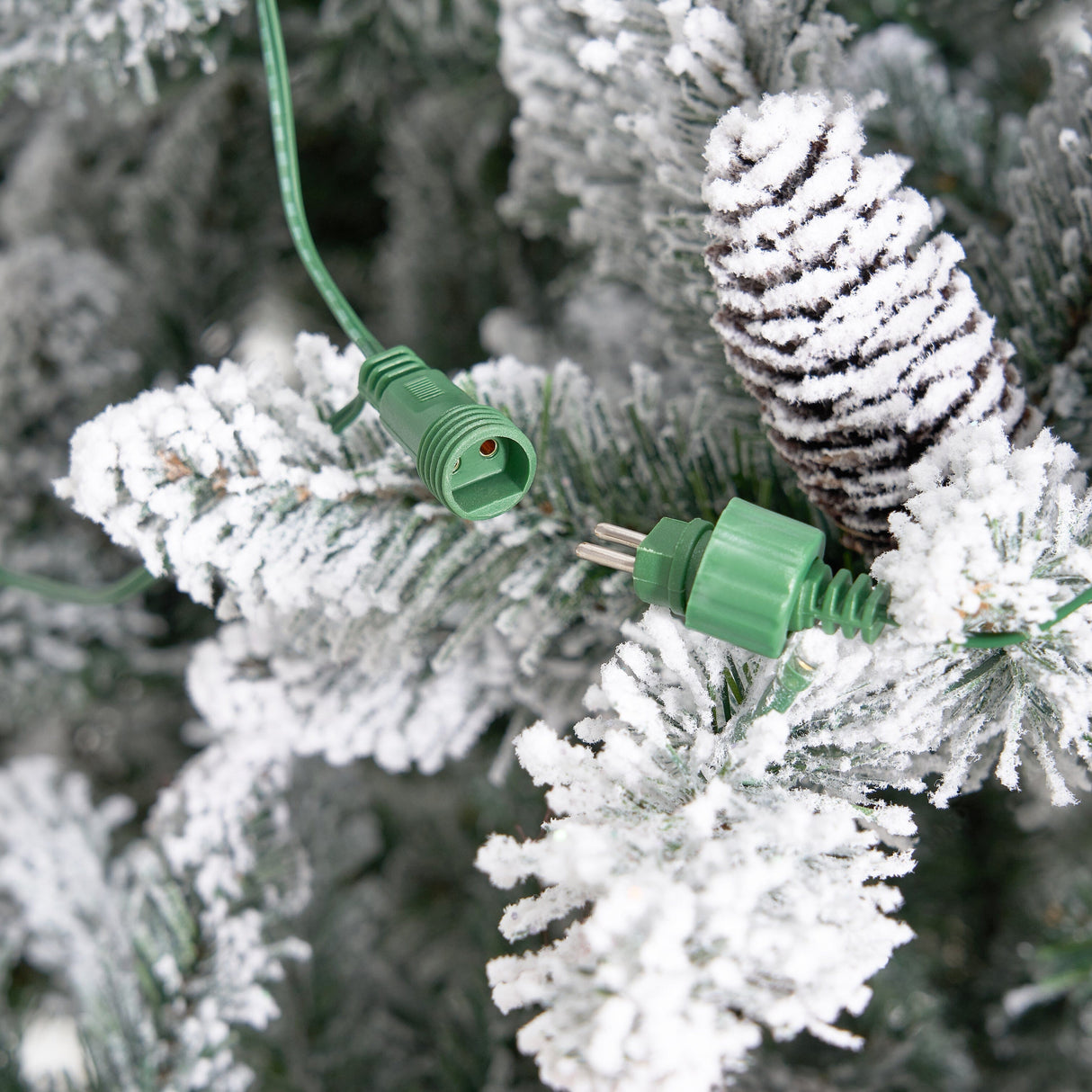 11’ Flocked Livingston Fir Artificial Christmas Tree with Pine Cones, 950 Clear Warm LED Lights and 3016 Bendable Branches from Nearly Natural