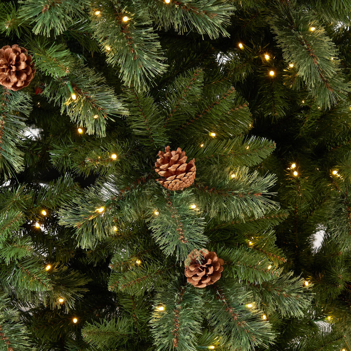 11’ White Mountain Pine Artificial Christmas Tree with 1050 Clear LED Lights, Pine Cones and 2395 Bendable Branches from Nearly Natural