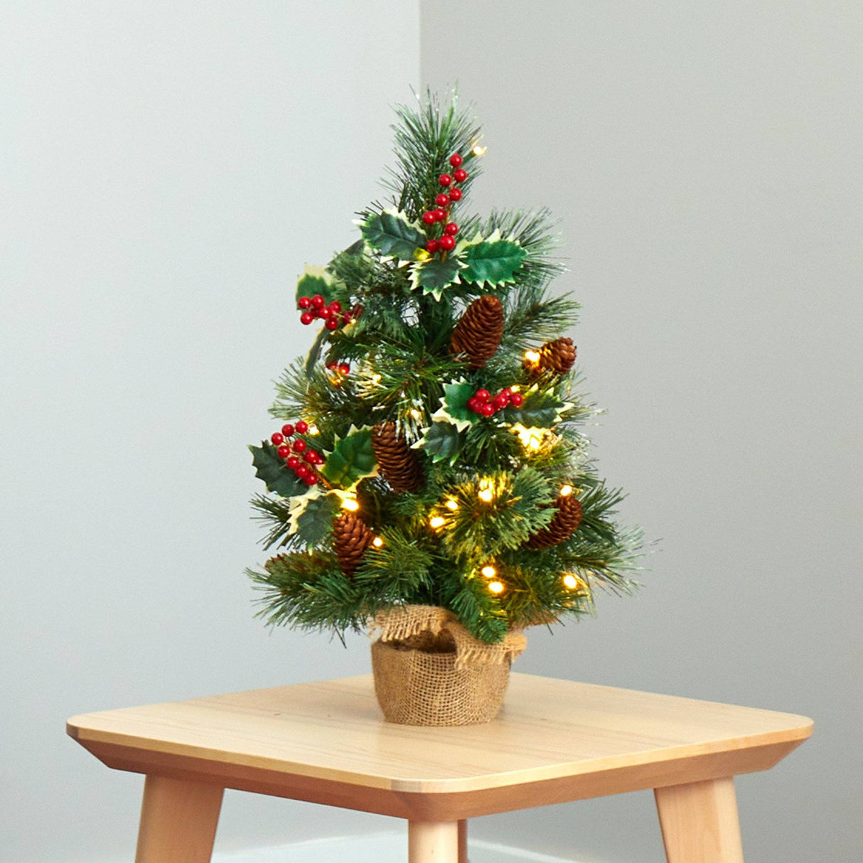 18” Mixed Pine Artificial Christmas Tree with Holly Berries, Pinecones, 35 Clear LED Lights and Burlap Base from Nearly Natural