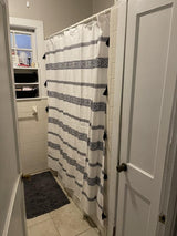 Ava Boho Stripe Tassel Yarn Dyed Recycled Cotton Shower Curtain from LushDecor