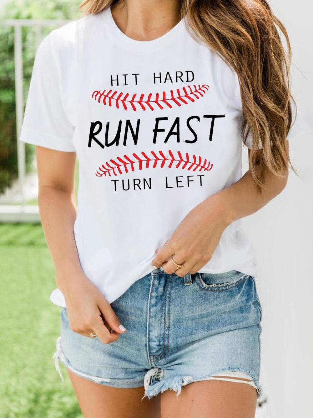Baseball Print White Tee with "Hit Hard Run Fast Turn Left" Design from MsDressly