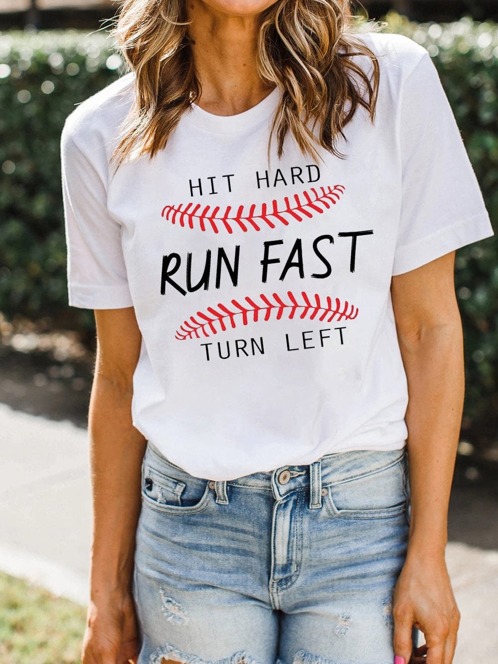 Baseball Print White Tee with "Hit Hard Run Fast Turn Left" Design from MsDressly
