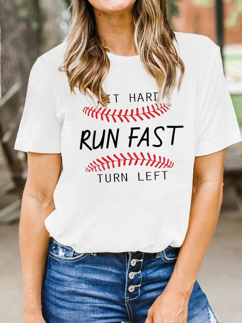 Baseball Print White Tee with "Hit Hard Run Fast Turn Left" Design from MsDressly