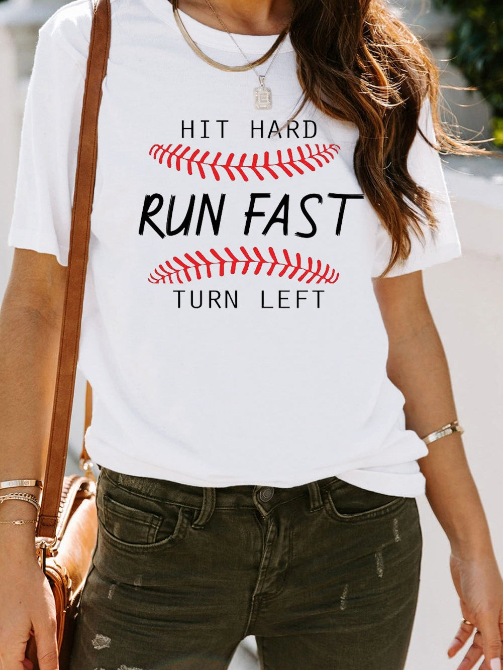 Baseball Print White Tee with "Hit Hard Run Fast Turn Left" Design from MsDressly
