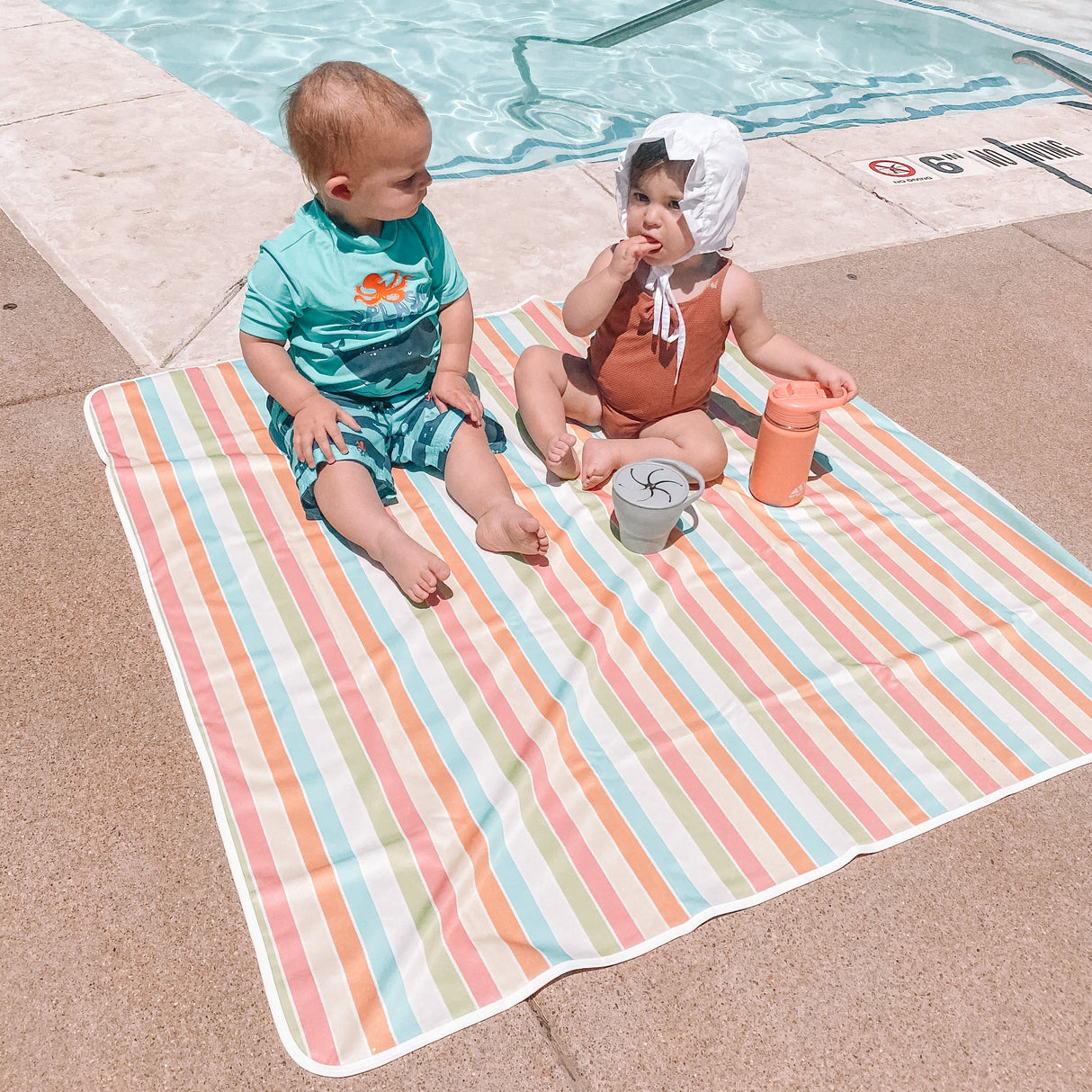 Rainbow Stripes Splash Mat - A Waterproof Catch-All for Highchair Spills and More! from BapronBaby