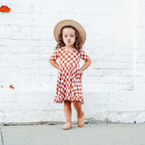 COPPER CHECKERS DREAM RUFFLE DRESS from DREAM BIG LITTLE CO