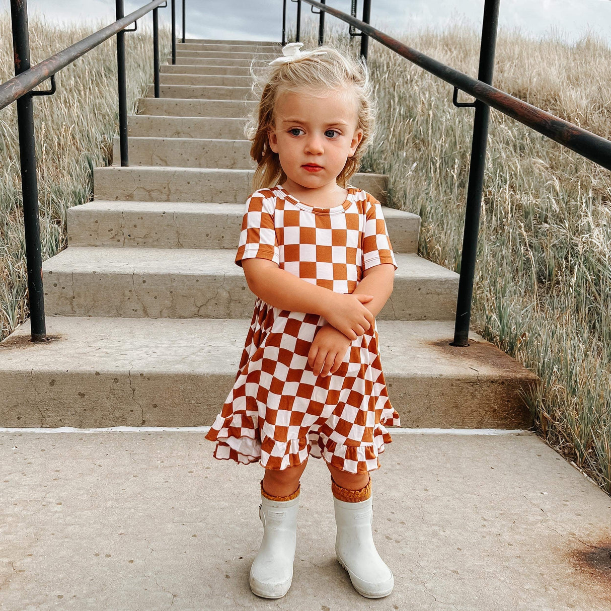 COPPER CHECKERS DREAM RUFFLE DRESS from DREAM BIG LITTLE CO