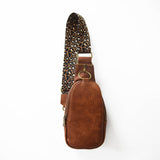 The Isla Sling Bag with Guitar Strap | Dark Brown with Leopard Strap from Babs+Birdie